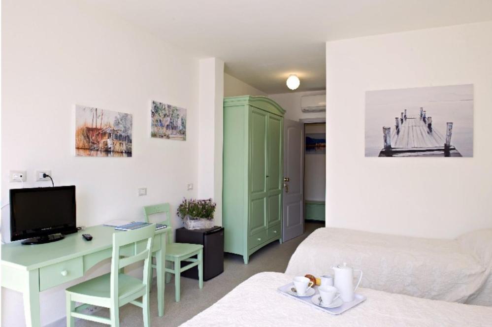 Televízia a/alebo spoločenská miestnosť v ubytovaní LIù B&B