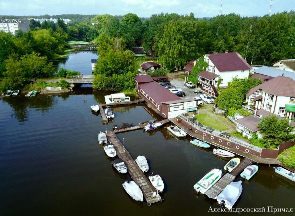 an aerial view of a marina with boats in the water at Fishing and hunting hotel Alexandrovsky Prichal in Ves'yegonsk