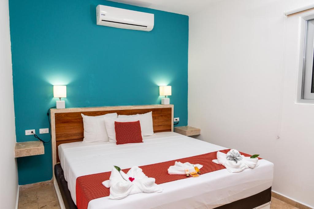 Postel nebo postele na pokoji v ubytování Hotel Playa Encantada