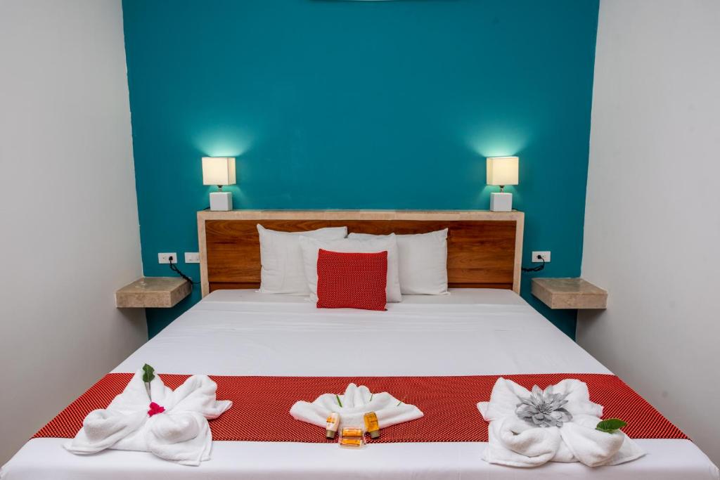 Postel nebo postele na pokoji v ubytování Hotel Playa Encantada