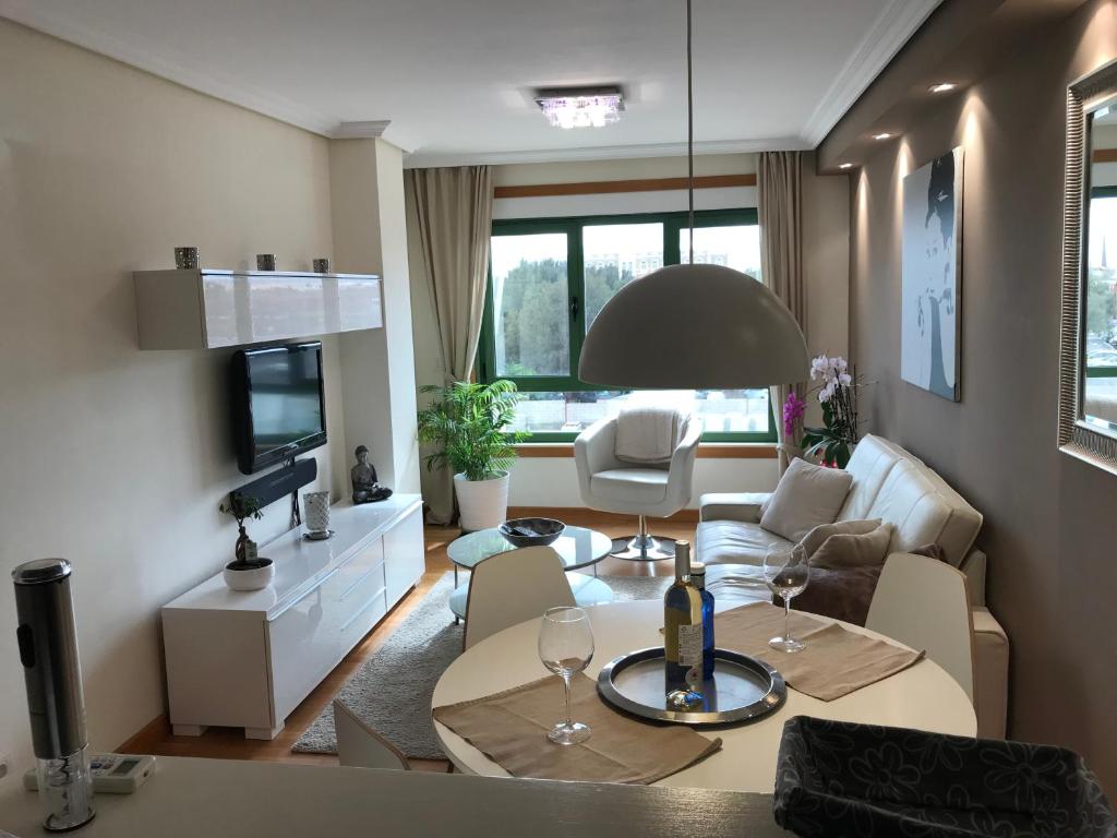 Televízia a/alebo spoločenská miestnosť v ubytovaní Casa City