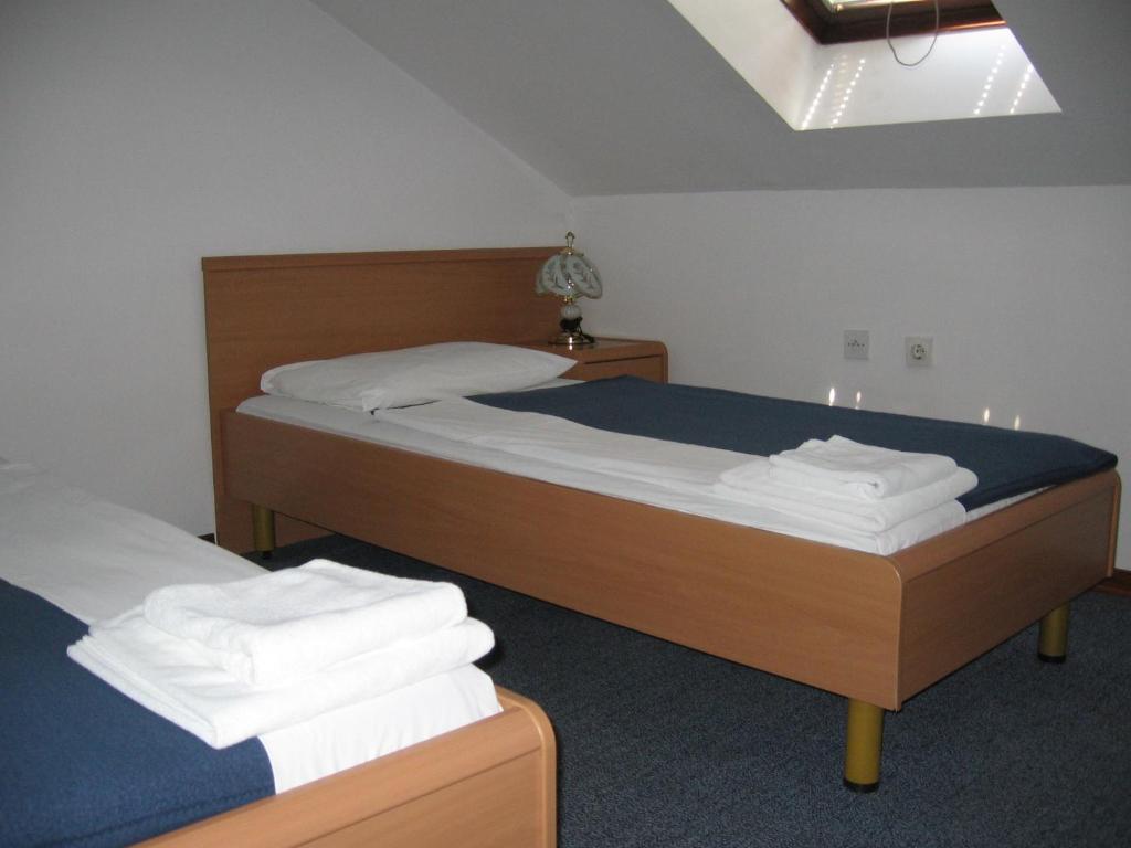 Postelja oz. postelje v sobi nastanitve Hotel Veli Jože
