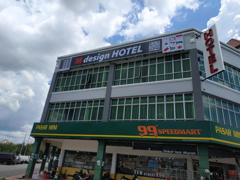 a building with a sign on top of it at M Design Hotel @ Bangi 7 in Bangi