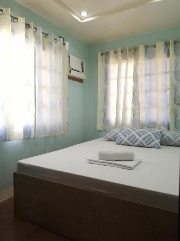 Postel nebo postele na pokoji v ubytování Vievan's transient house