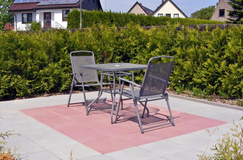 a table and two chairs sitting on a patio at Ferienwohnung Damshagen in Damshagen