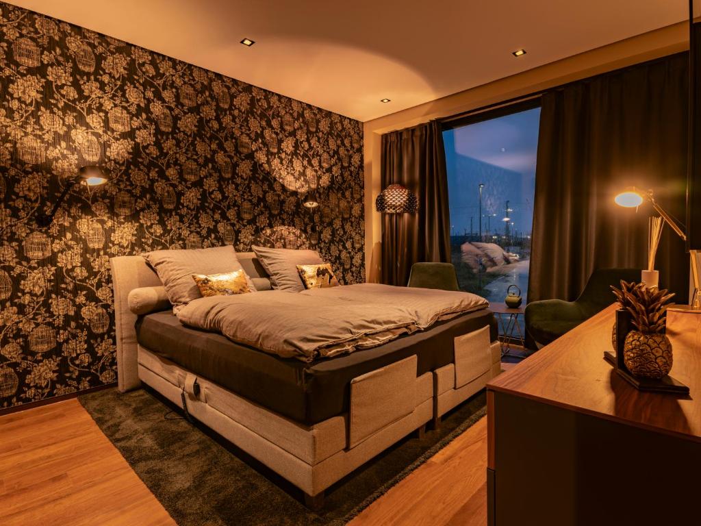 Una cama o camas en una habitación de OHANA Suite by ZZN im Zahnzentrum Nord