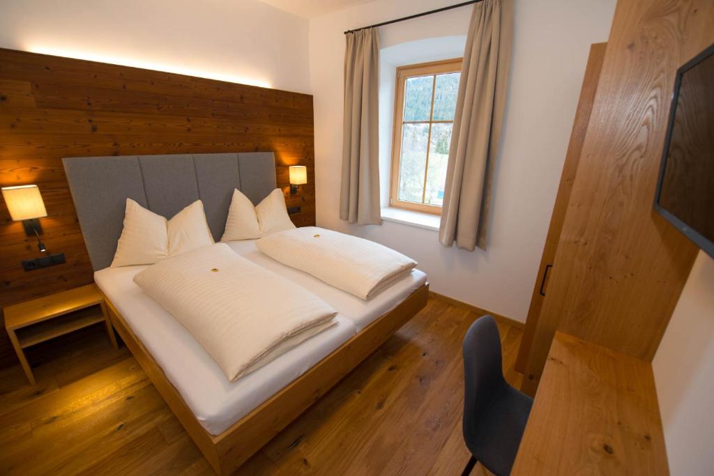 Postel nebo postele na pokoji v ubytování Hotel Brunnwirt