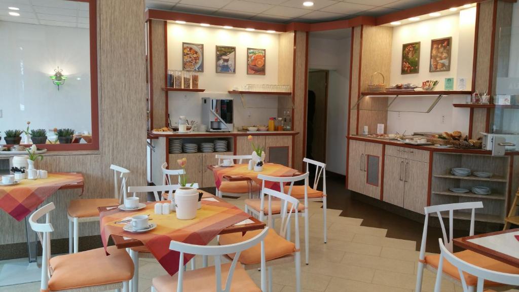 Kuchyň nebo kuchyňský kout v ubytování Hotel Alpha