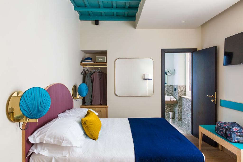 A bed or beds in a room at Condominio Monti Boutique Hotel