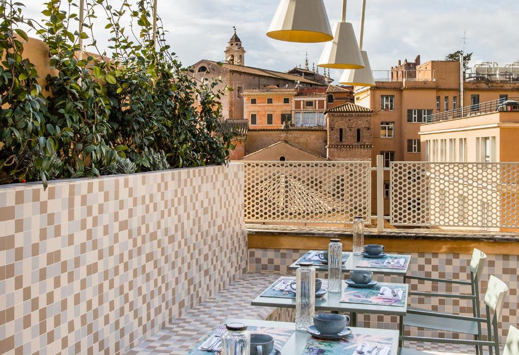 A balcony or terrace at Condominio Monti Boutique Hotel