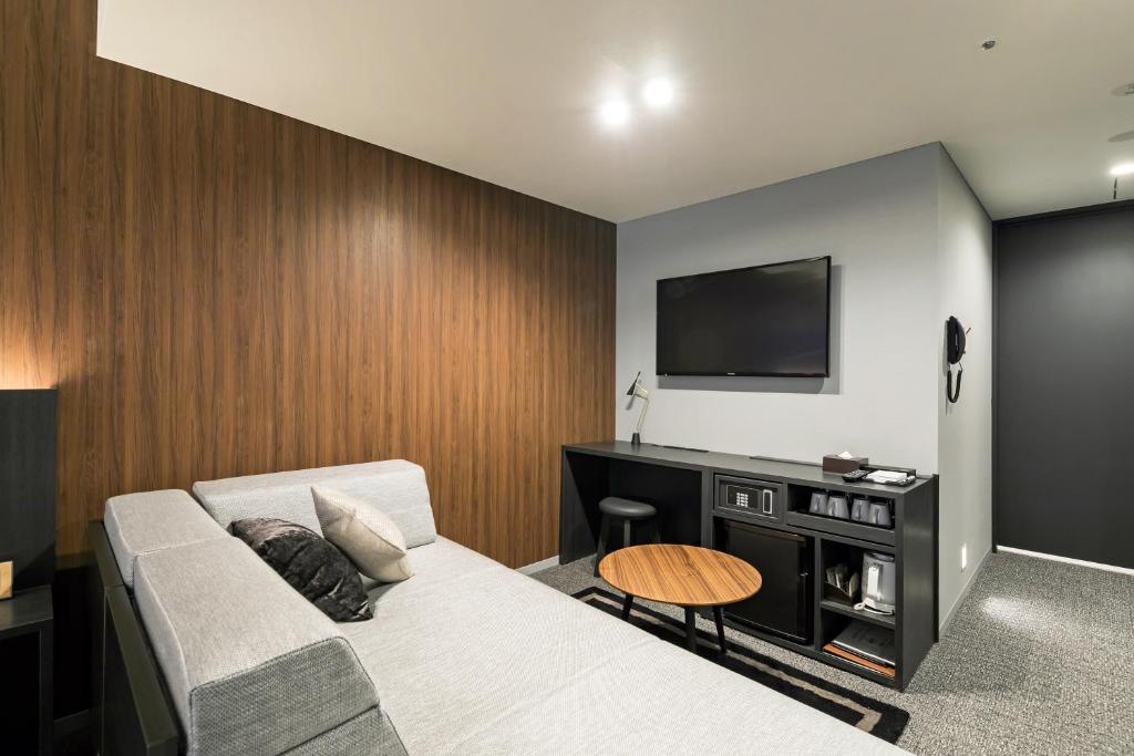 TV a/nebo společenská místnost v ubytování Ginza Capital Hotel Moegi