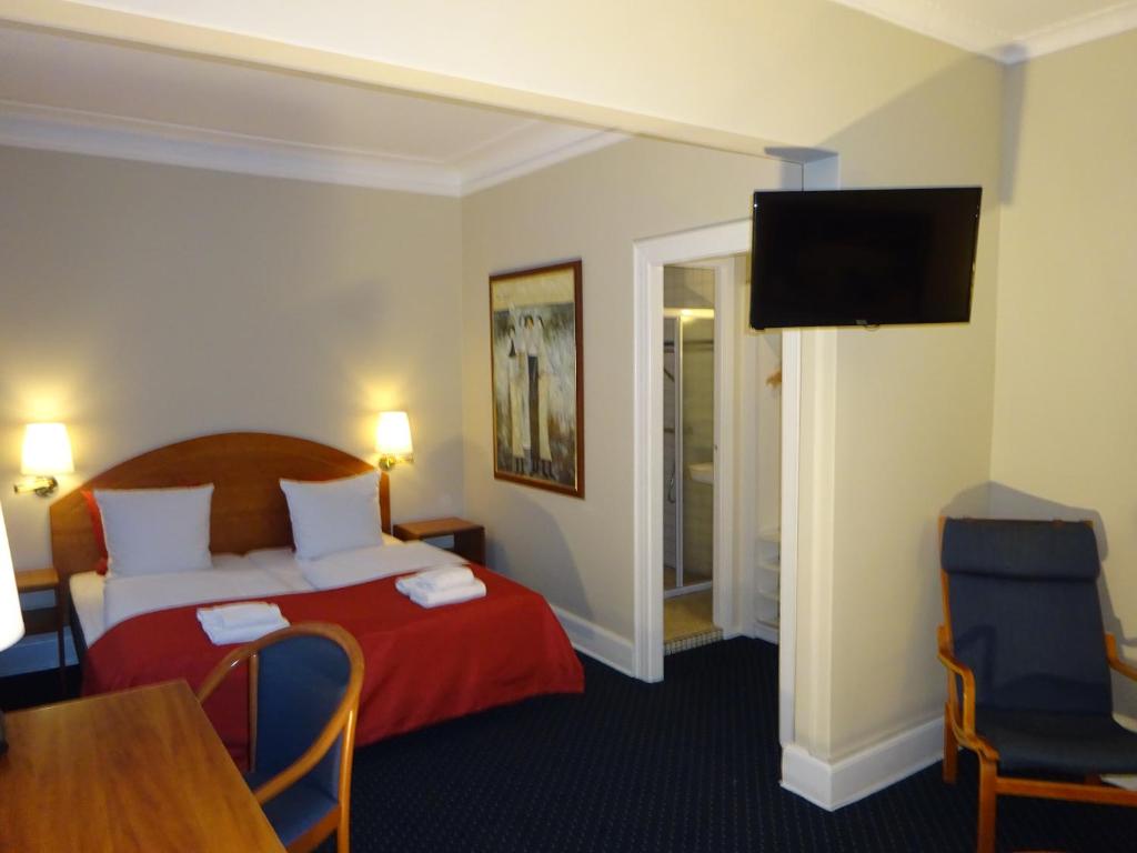Postel nebo postele na pokoji v ubytování City Hotel Nebo