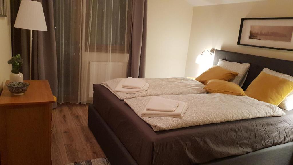 A bed or beds in a room at Stará Lesná ADEX