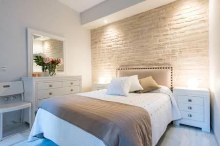 Un pat sau paturi într-o cameră la Apartment Villegas