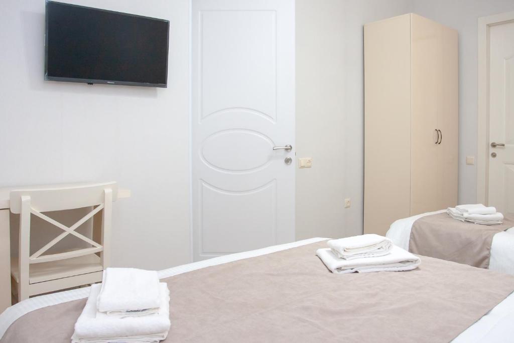 Postel nebo postele na pokoji v ubytování Hotel Casa calda