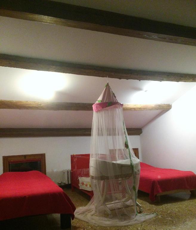 A bed or beds in a room at Cà Sardi