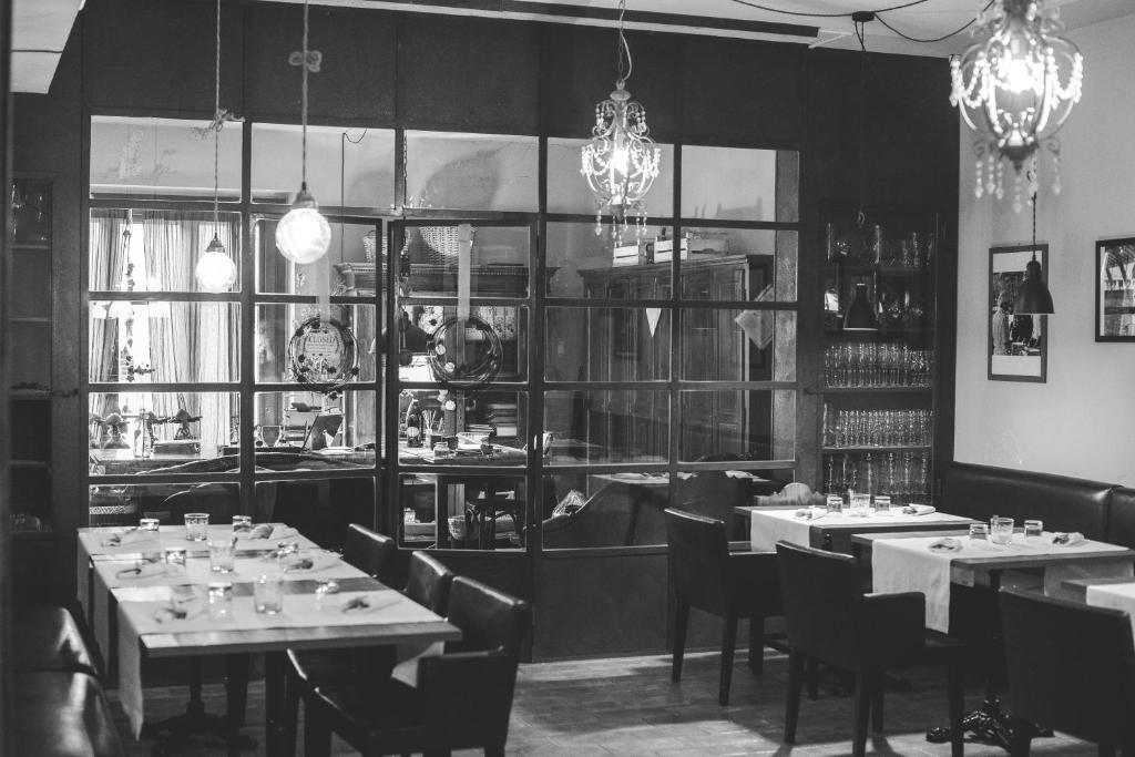 a black and white photo of a restaurant with tables and chairs at Il Felcino in Fabro