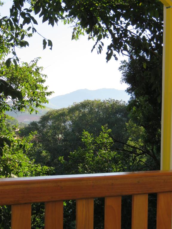 a porch with a view of the mountains at Lagoa Seca Hotel Rural in São Lourenço