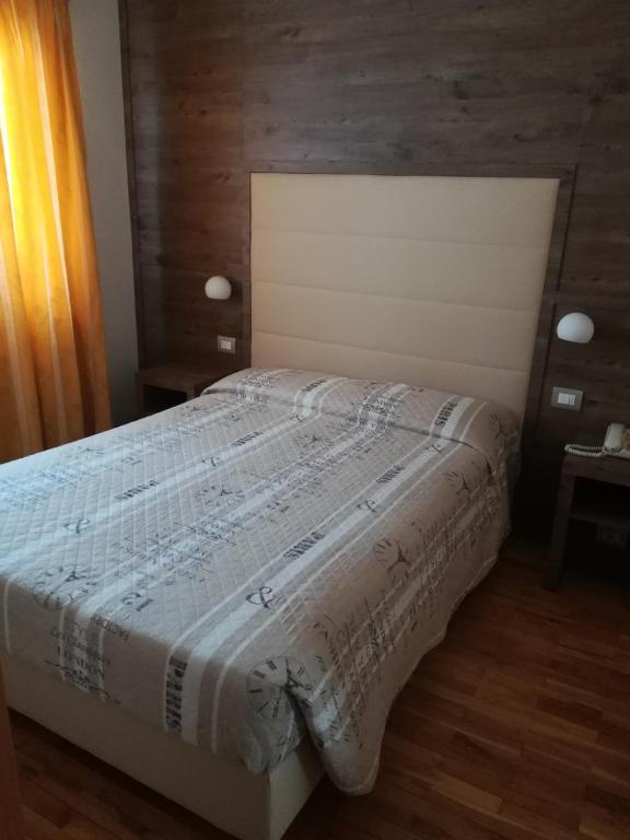 Postel nebo postele na pokoji v ubytování Hotel Miramonti