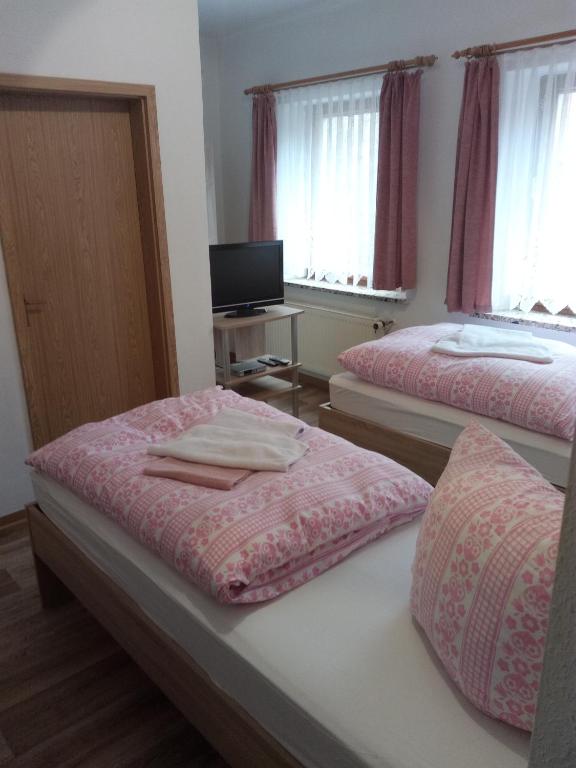 Postel nebo postele na pokoji v ubytování Am Mühlteich