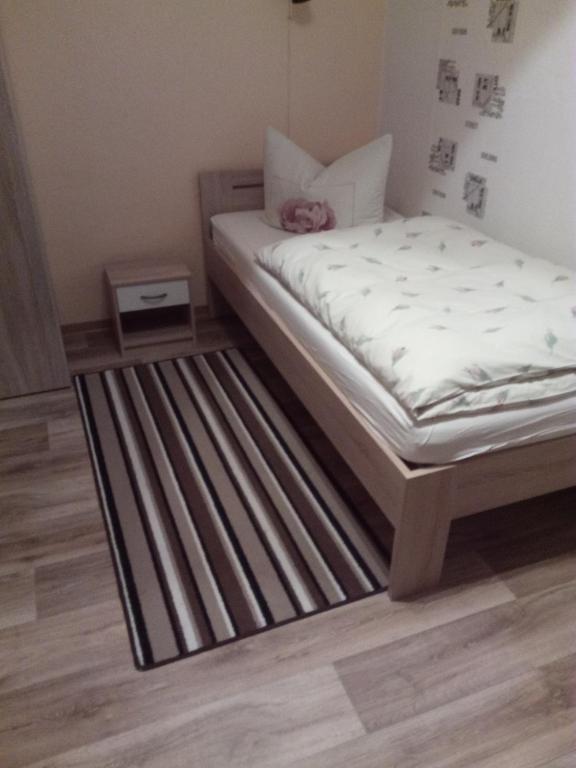 Postel nebo postele na pokoji v ubytování Am Mühlteich