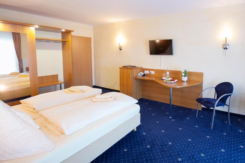 Postel nebo postele na pokoji v ubytování Landgasthof-Hotel Zum Steverstrand