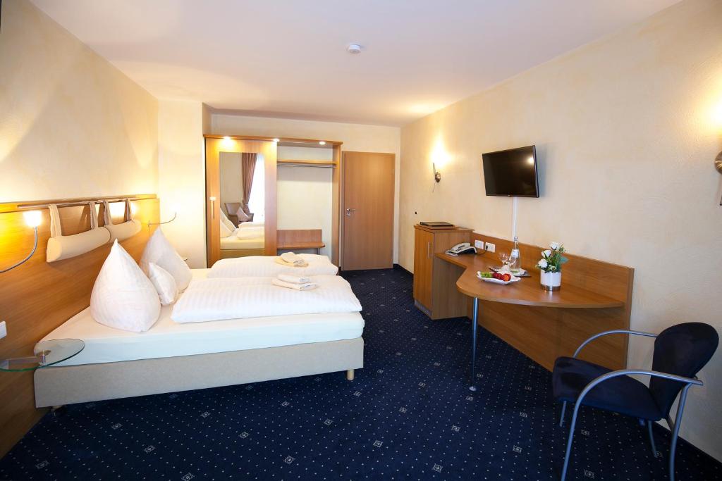 Postel nebo postele na pokoji v ubytování Landgasthof-Hotel Zum Steverstrand