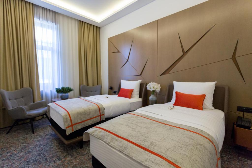 Postel nebo postele na pokoji v ubytování Hotel Austria & Bosna