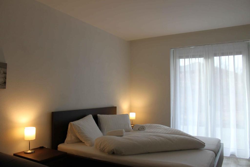 Postel nebo postele na pokoji v ubytování Apartmany Arcadia