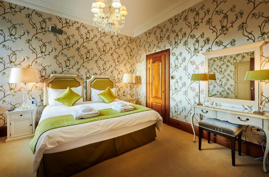 Postel nebo postele na pokoji v ubytování Alexander Residence