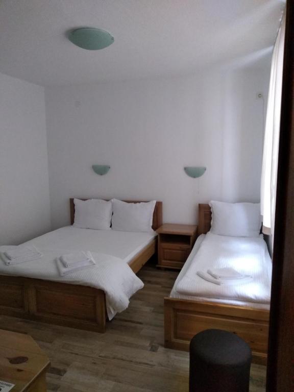 Postel nebo postele na pokoji v ubytování Guesthouse White Margarit