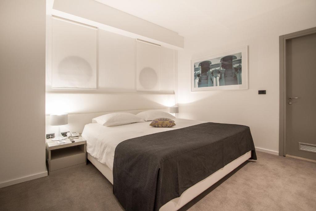 Postel nebo postele na pokoji v ubytování Hotel Atrium