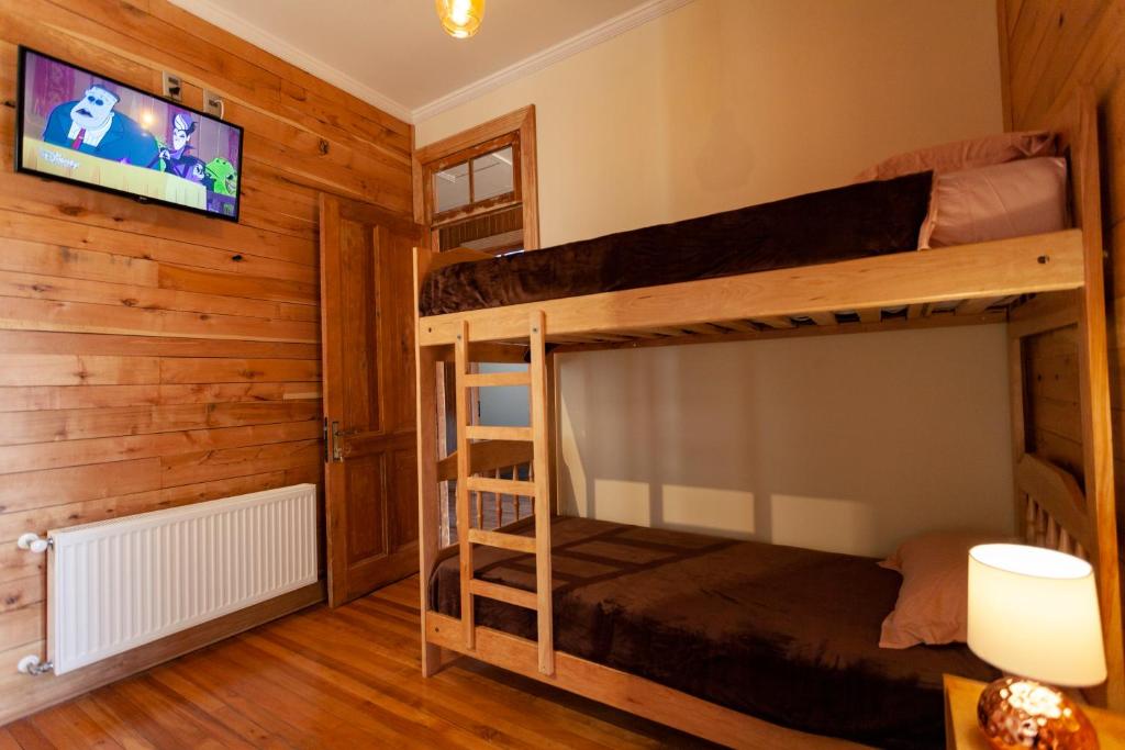 Postel nebo postele na pokoji v ubytování Hostal Boutique Patagonia Mística