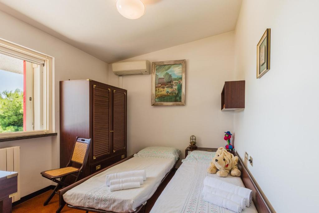 A bed or beds in a room at Villa Claudia