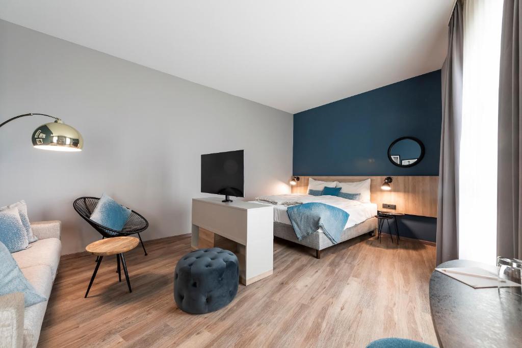 Postel nebo postele na pokoji v ubytování HARBR. hotel Heilbronn