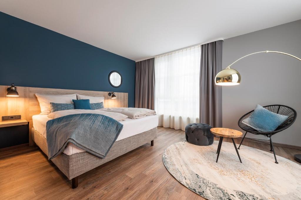 Postel nebo postele na pokoji v ubytování HARBR. hotel Heilbronn