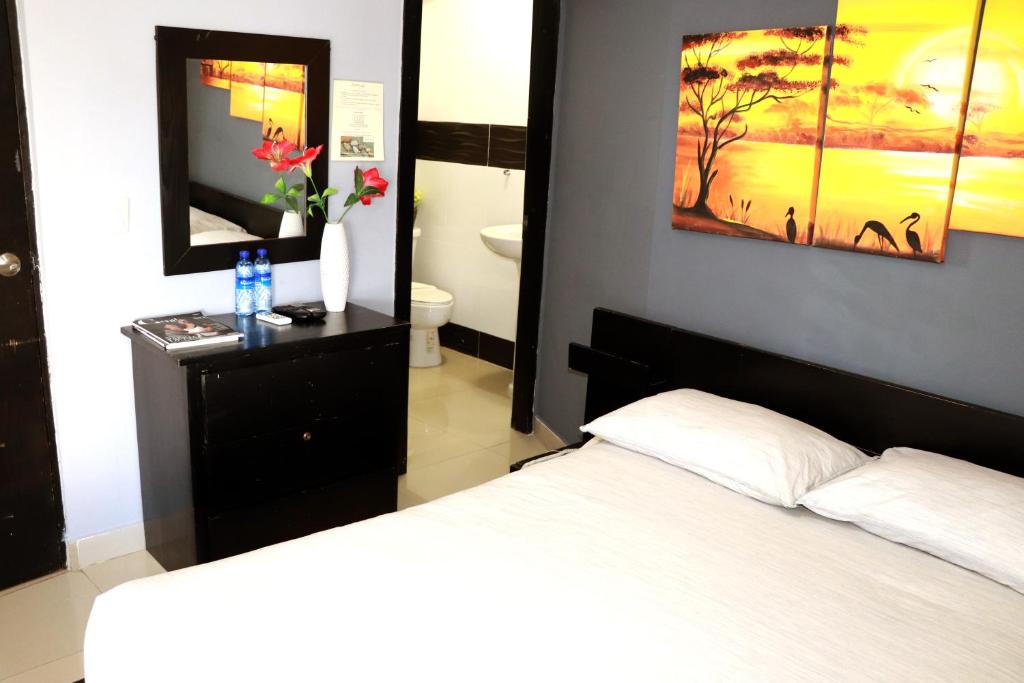 Postel nebo postele na pokoji v ubytování Hotel Merey