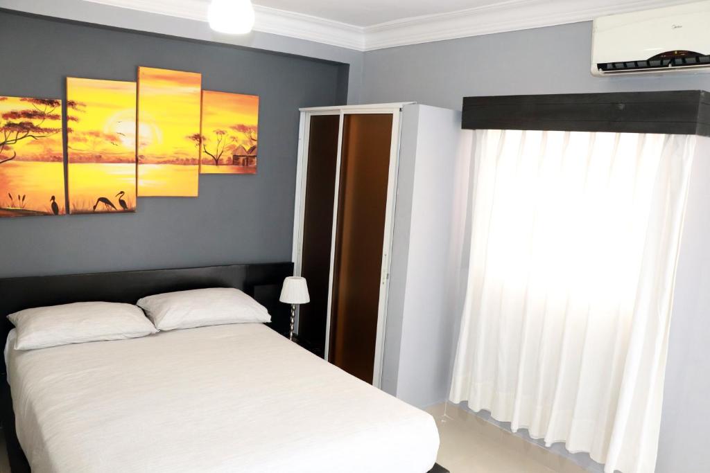 Postel nebo postele na pokoji v ubytování Hotel Merey