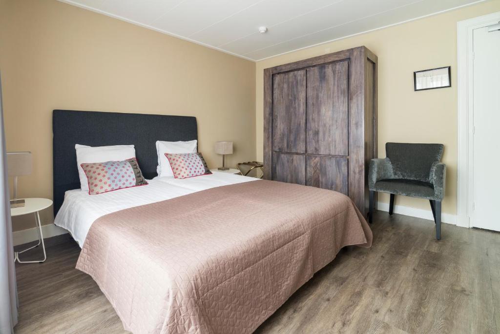 Postel nebo postele na pokoji v ubytování Hotel Loco