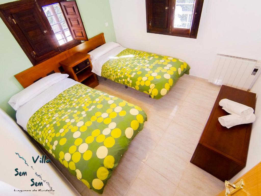 A bed or beds in a room at Casas Rurales Villa Sem Sem