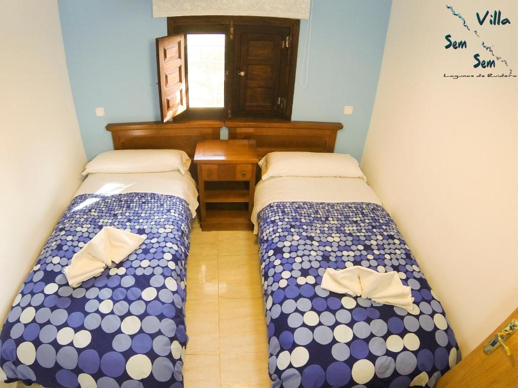 A bed or beds in a room at Casas Rurales Villa Sem Sem
