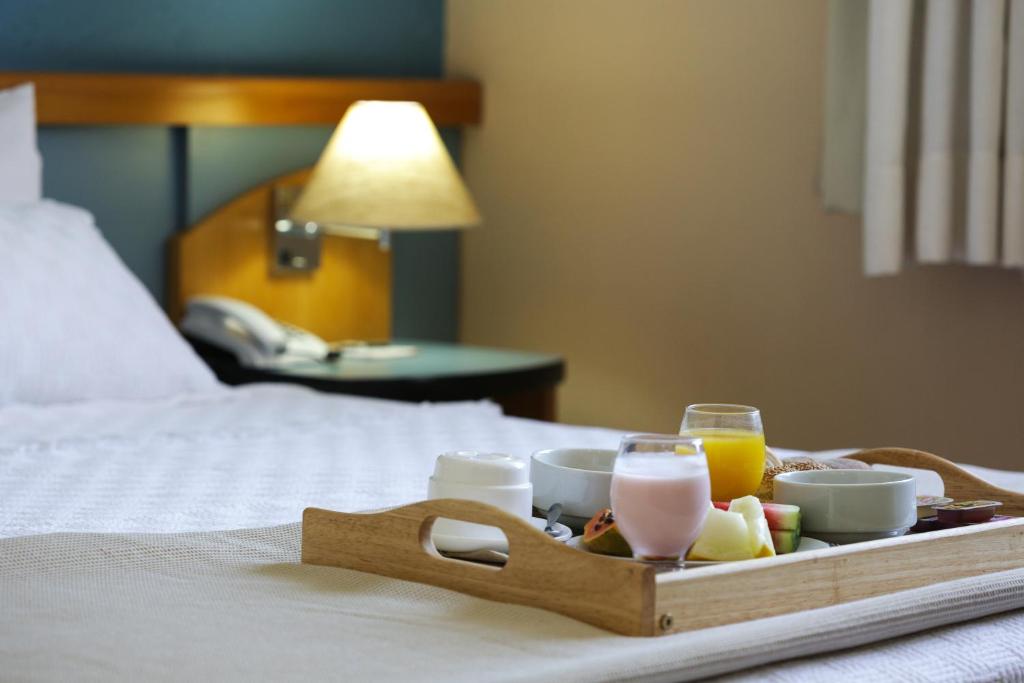 Postel nebo postele na pokoji v ubytování Sables Hotel Guarulhos