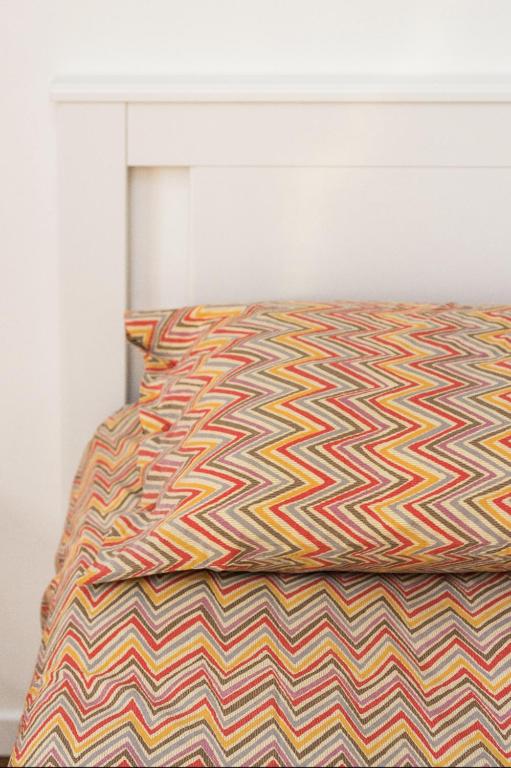 A bed or beds in a room at New Capolinea 5 - Apartment