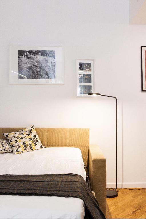 A bed or beds in a room at New Capolinea 5 - Apartment
