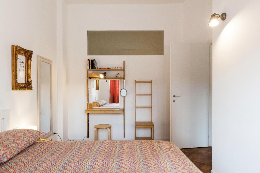 A bed or beds in a room at New Capolinea 5 - Apartment