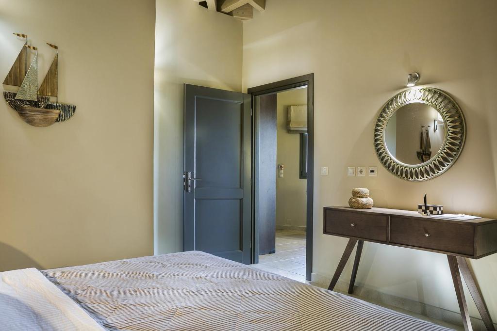 A bed or beds in a room at Brand New Skala Beach Apartment- Pieno Di Luce