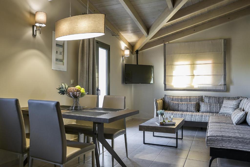 A television and/or entertainment centre at Brand New Skala Beach Apartment- Pieno Di Luce
