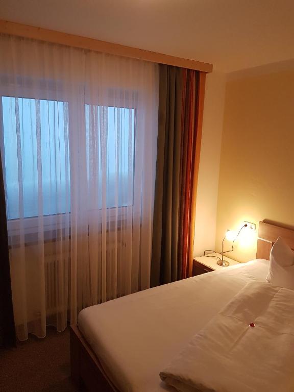 Postel nebo postele na pokoji v ubytování Aparthotel Hohe Brücke