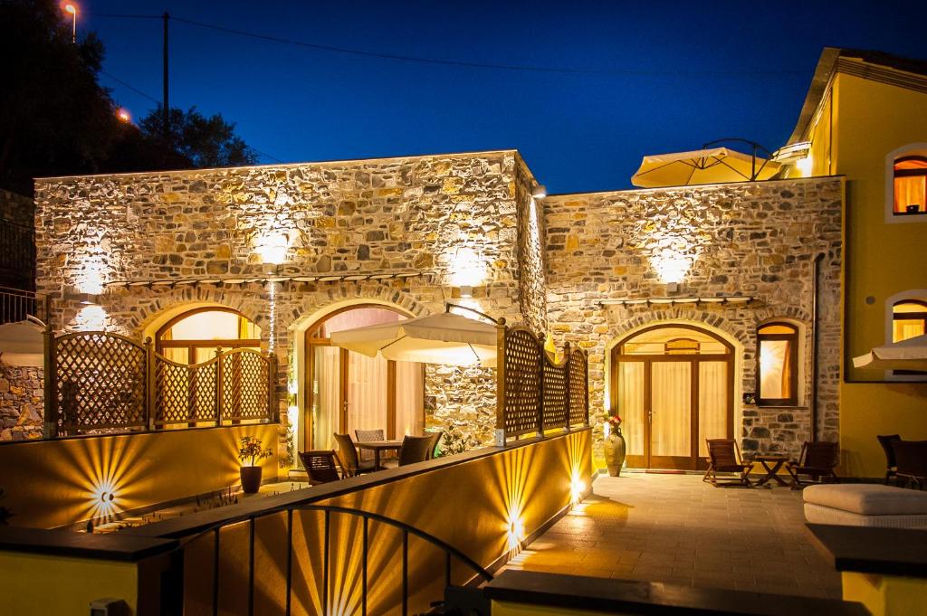 a stone building with lights on it at night at Appartamenti Antico Frantoio Doria in Imperia