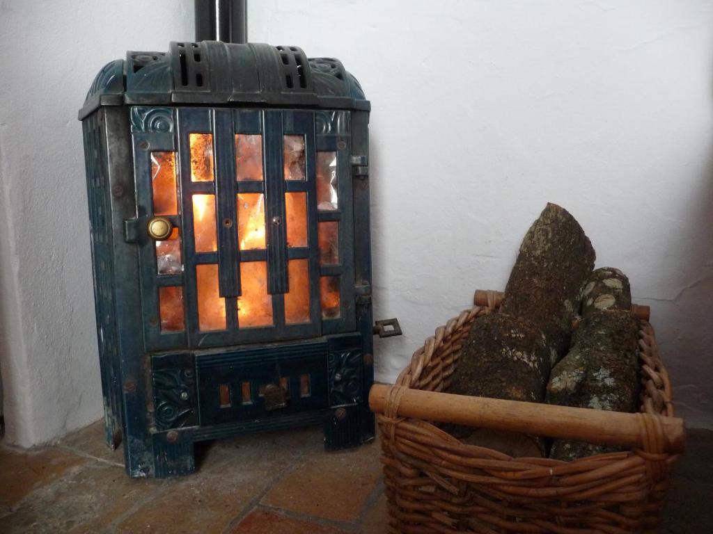 a lantern sitting next to a basket with a candle at Casa Sol in Vejer de la Frontera